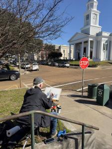 Waters in Downtown Natchez on Jan. 16, 2024, at the corner of State and Pearl Streets, while painting the First Presbyterian Church of Natchez. Photo by Paul Peterson.