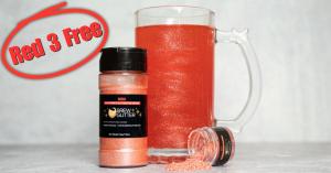 red glitter drink next to a beer stein