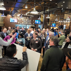 A crowd of people at our GYBL Happy Hour