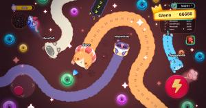 Gameplay screenshot of Snaky Cat showing long snake-like cats slithering amongst each other in a donut-filled arena.