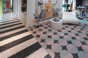 Terrazzo floors with abstract patterns.