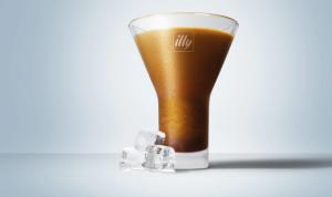 Glass of Illy Freddo Espresso served with ice cubes on a clean, minimalist background, showcasing its rich, smooth texture and refreshing appeal.