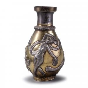 Silver vase with dancing girls, peacock, and two  small boys.