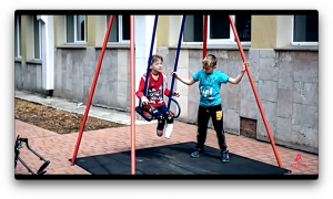 Injured children in Ukraine play on swings