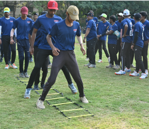 Young Baseball players at Diamond Dreams Academy, engaged in focused training drills on the field