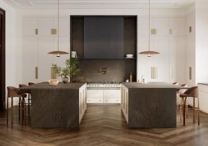 Cambria 2025 quartz surface introduction, Remington Brass™, is shown in a sophisticated gourmet kitchen. Its dark coloring contrasts with the light tones of the walls and cabinets fronts, and its brass alloy veining coordinates with cabinetry hardware.