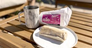 Coffee cup and Burrito on the plate