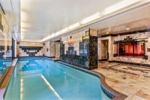 Grand entertaining spaces, wine salon, indoor pool, spa, and sauna