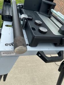 picture of a piece of metal on the bed of a chop saw