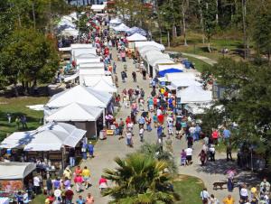 Aerial photo of crowds of people on art festival grounds.