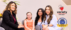 Three women and a girl seated together in a cozy setting, promoting support and community for children's charities.