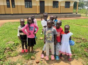 CEO of Amigos, Michael Ryer with Children at Ogul Village