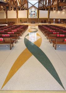 Terrazzo design: Winding bands of colorful terrazzo mark the processional aisle in the church