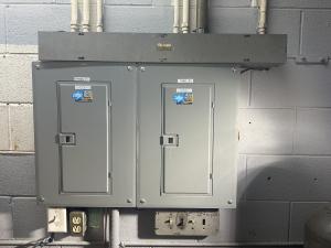 Newly installed electrical panel in a building.