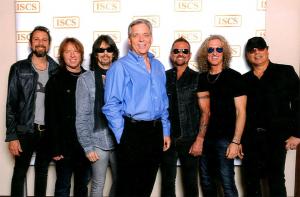Ed in blue shirt with the full band of Foreigner