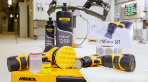 Mirka Iridium 1250 Pro products and polishing tools displayed in a clean, professional workspace with rack focus background.