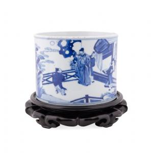 Chinese Kangxi period (1661-1772) blue and white porcelain brush pot with figural scenes, just 5 ½ inches tall minus the wooden stand ($24,200).