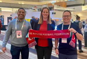 USAFF board members pose with U.S. Soccer President Cindy Parlow Cone, holding a US Amputee Football Federation scarf at the 2025 U.S. Soccer Annual General Meeting.