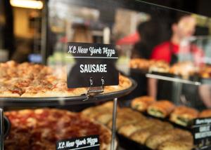Sbarro's XL NY Pizza's on Display for Guests to Select Their Slice