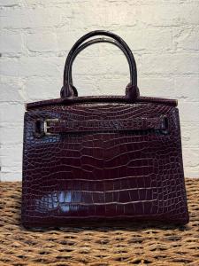 Ralph Lauren RL50 medium Bordeaux cream calfskin leather handbag in great condition, with western stitching, detachable shoulder strap and brown leather lining (Estimate: $18,000-$22,000).