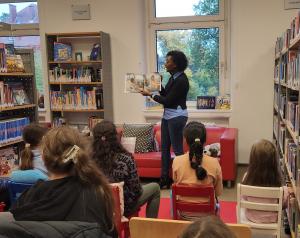 Courtney with her self-published books, Celeste Saves the City and Celeste Tunnels Underground