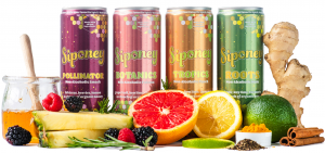 Siponey Spritz Co. Non-Alcoholic Cocktails and Mixers surrounded by fresh fruit ingredients