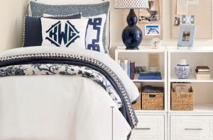 Dorm Room bed with white and blue bedding in classic Ballard Designs style.