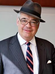 What defines a multi-generational legacy in business and community service? In Gates, New York, the Gizzi family stands as a compelling example of how innovation in industry and dedication to civic life can go hand in hand Photo fo John P. Gizzi wearing a suit and hat