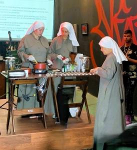 three sisters teaching a class in salve making