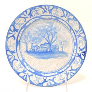 Dedham Pottery plate depicting the Franklin House with a rabbit border, 8 inches in diameter. Estimate: $200-$300