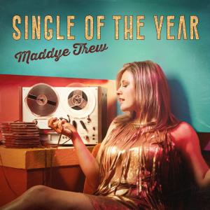 Cover art is a photo of Maddye Trew sitting in front of an old analog reel-to-reel tape recorder.