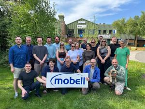 The staff of Mobell Cmmmunications Limited, gathered outside their offices