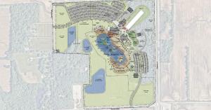 Flattened design rendering of the SkyLake site plan. The plan shows a large central lake with surrounding attractions, along with areas designated for land adventures, parking, and event space.
