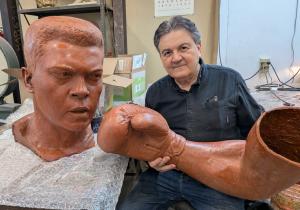 A towering 10-foot bronze statue honoring Muhammad Ali will be publicly unveiled Saturday, May 31, at 2 p Sculptor Zenos Frudakis works on wax casts of his Muhammad Ali statue at the Laran Bronze Foundry in Chester, Pa.