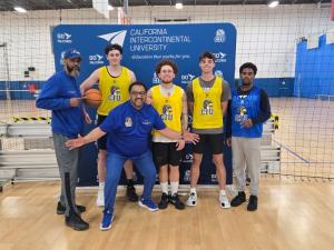 Student-athletes with Coach Gamal after a basketball tryout.