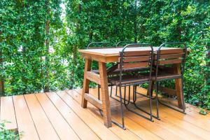 wooden outdoor deck with chairs