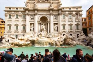 A crowded day in front of the beautiful Trevi Fountain in Rome.