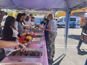 The LATLC & Bresee Volunteers serving food for the mothers at their sixth annual Mother's Day Event in LA at the Bresee Youth Center