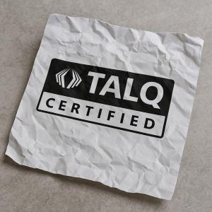 TALQ-certified logo on a wrinkled paper