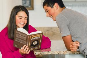 The Tuttle Twins series is launching a new book entitled The Tuttle Twins’ Guide to the World’s Worst Ideas Two teens reading a book