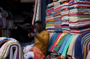 Market trader in Gikomba market in Nairobi at his stall
