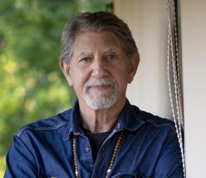 a close up photo of actor Peter Coyote