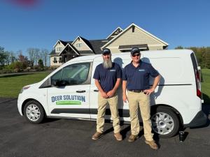 Owner Steve Dalessandro stands with Justin Smith in front of their van ready to start their Deer Solution business journey.