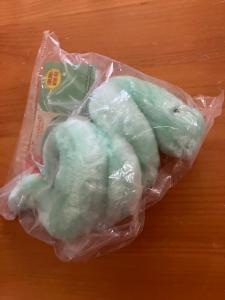 A Lyme green corkscrew shaped Plushie made to look like a Lyme Spirochete Raffle Prize
