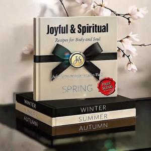 America Publishers is proud to announce that the much-anticipated second installment in the acclaimed Joyful & Spiritual series, "Joyful & Spiritual – Spring Edition" by Julia Reno and Dr Stack of hardcover books from the Joyful & Spiritual series arranged by season, with the Spring Edition displayed on top. Includes a “Free Song” badge, elegant design, and cherry blossom backdrop to reflect renewal and faith.