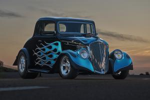 1933 Willys sedan painted black with blue hot rod flames