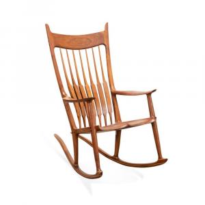 Brazilian rosewood and mixed wood rocking chair by Sam Maloof (American, 1916-2009),crafted in 1988 and signed, dated and numbered (45) to the underside of the seat. Estimate: $20,000-$30,000
