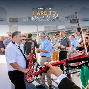 Live musicians perform during a corporate yacht event in Miami, used as part of a campaign highlighting client engagement solutions