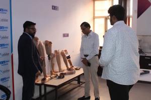 Praveen Karn, Head Sustainability Spark Minda Foundation showing the project at Akarshan