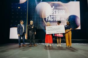 CEO of Experior Financial Group Jamie Prickett presenting Ronald McDonald House Charities with $125K Check